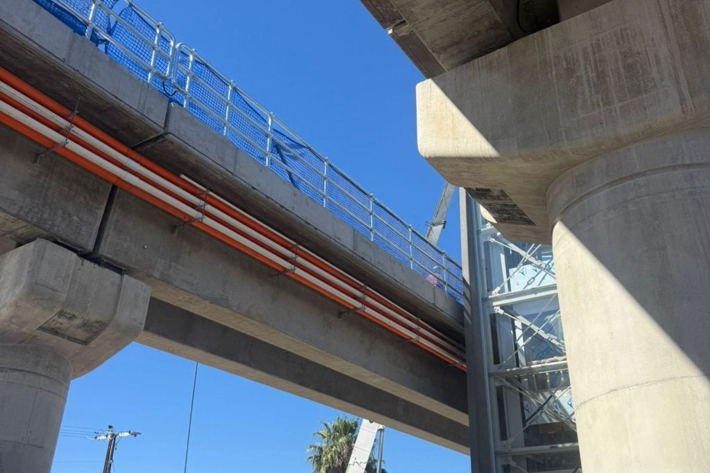 Tram Grade Separation Project conduit works beneath tram overpass Apex Energy Australia electrical and communications conduits installed beneath an Adelaide tram overpass for the Tram Grade Separation Project.